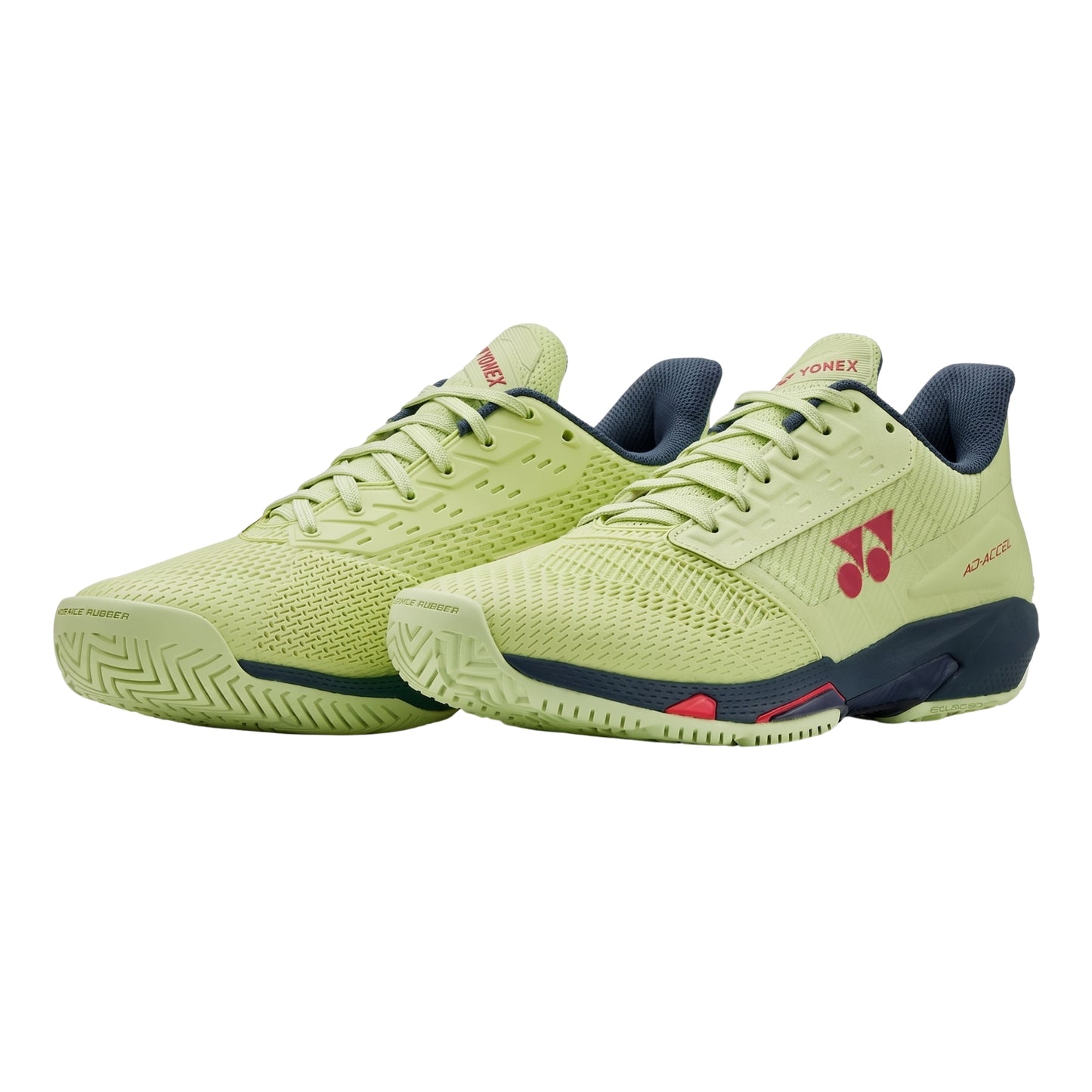Pair of green Yonex shoes with a brand logo on a white background