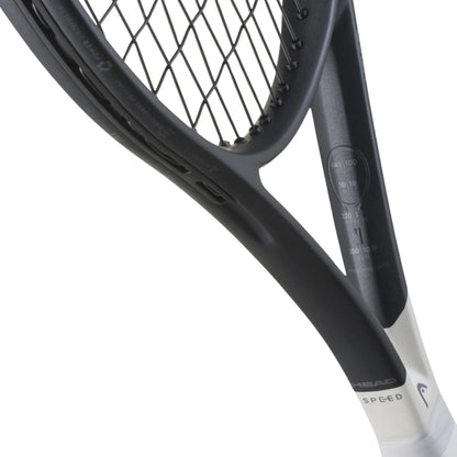 Close-up of a tennis racket with a white background