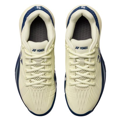 Pair of Yonex tennis shoes on a white background