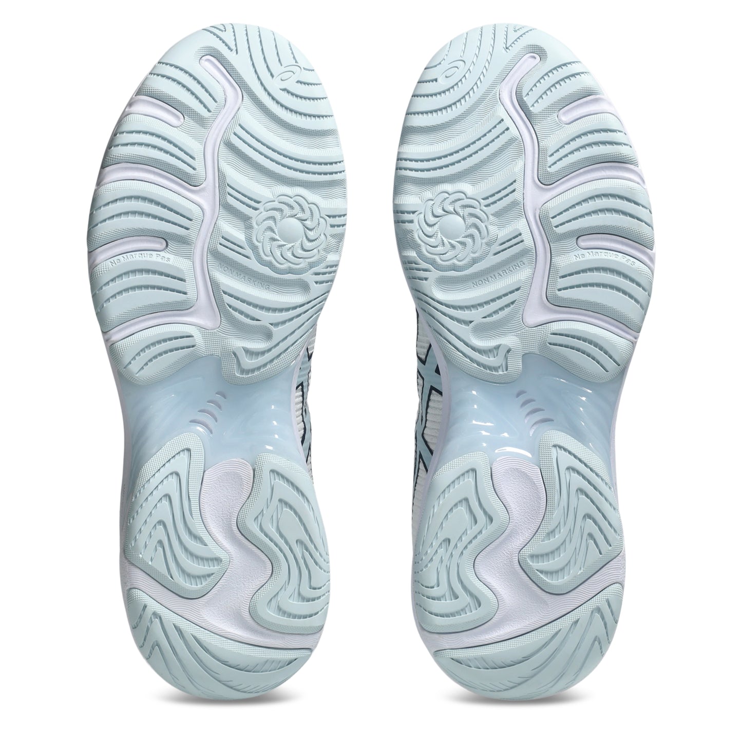 Close-up of light blue netball shoe soles on a white background