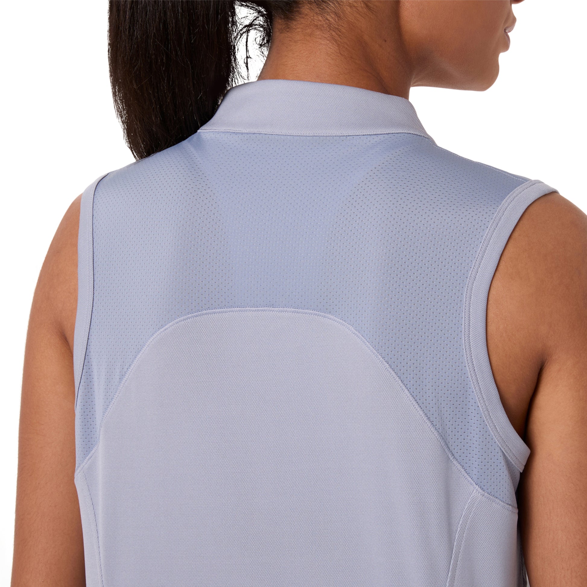 Light blue sleeveless top worn by a person on a white background