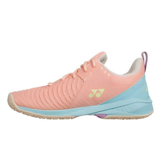 Pink and blue Yonex tennis shoe with a visible brand logo on a white background