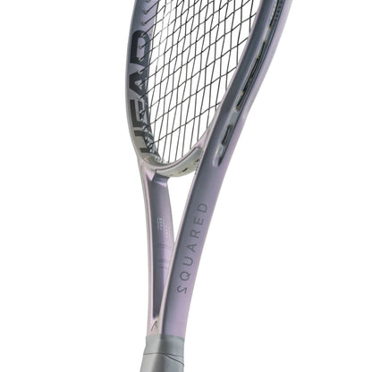Close-up of a tennis racket with 'HEAD' branding on a white background
