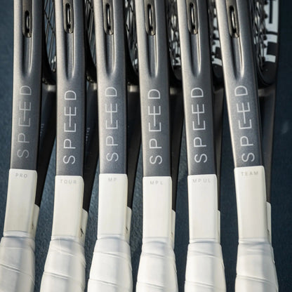 Multiple tennis rackets with 'SPEED' branding on a dark background
