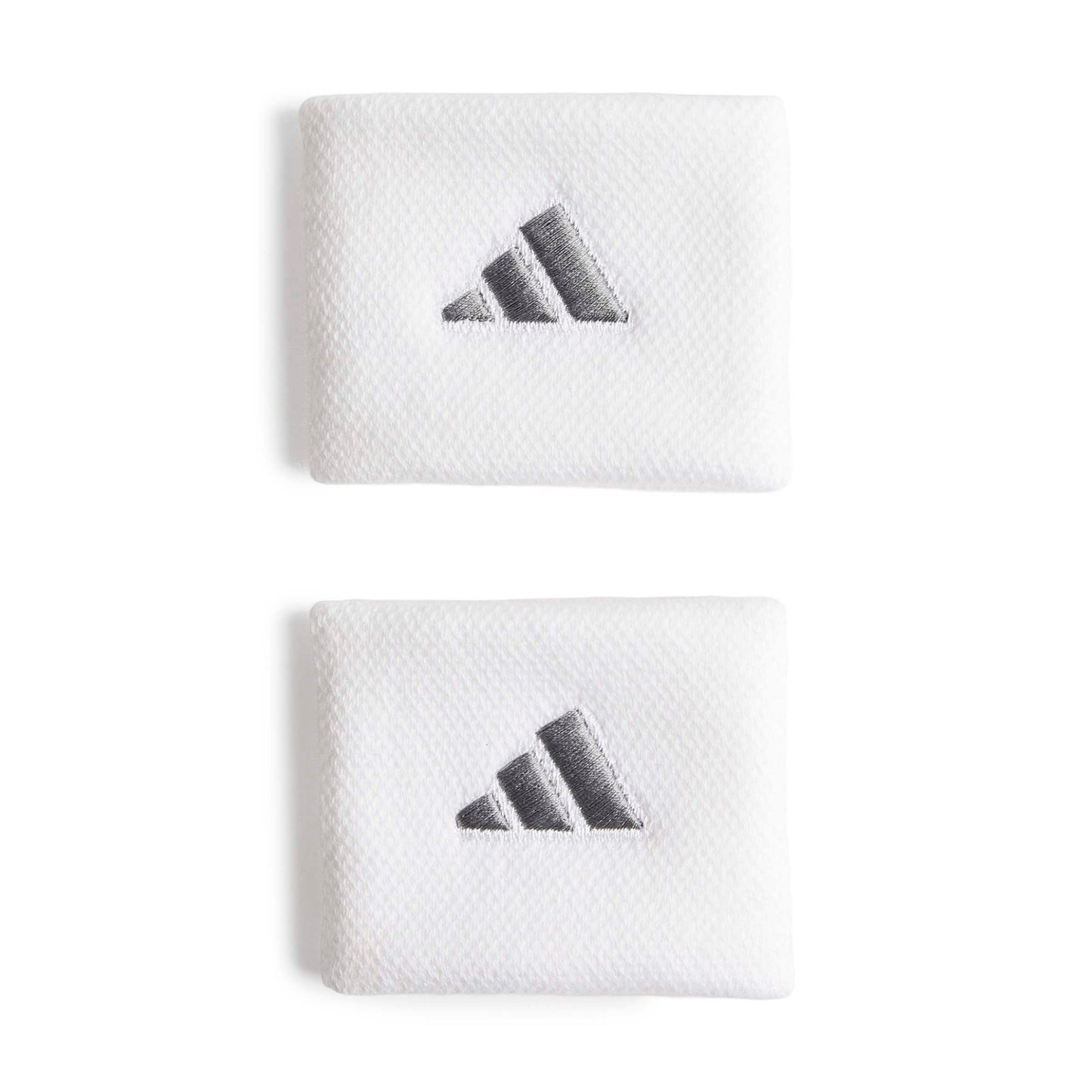 White adidas wristbands with a silver logo on a white bacground