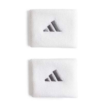 White adidas wristbands with a silver logo on a white bacground