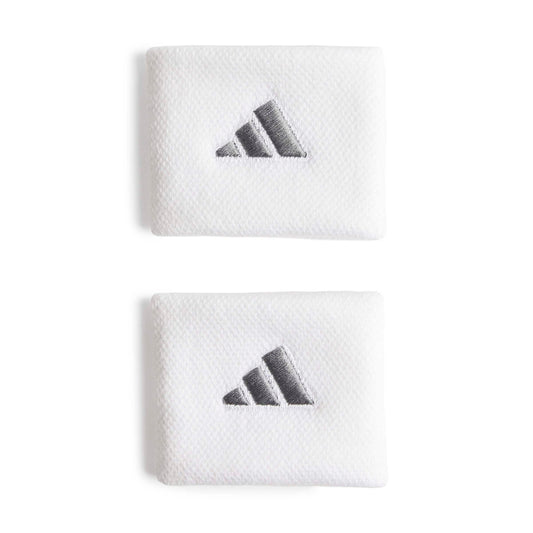 White adidas wristbands with a silver logo on a white bacground