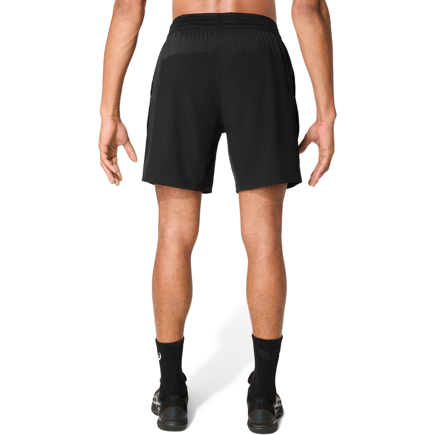 Man wearing black shorts on a white background