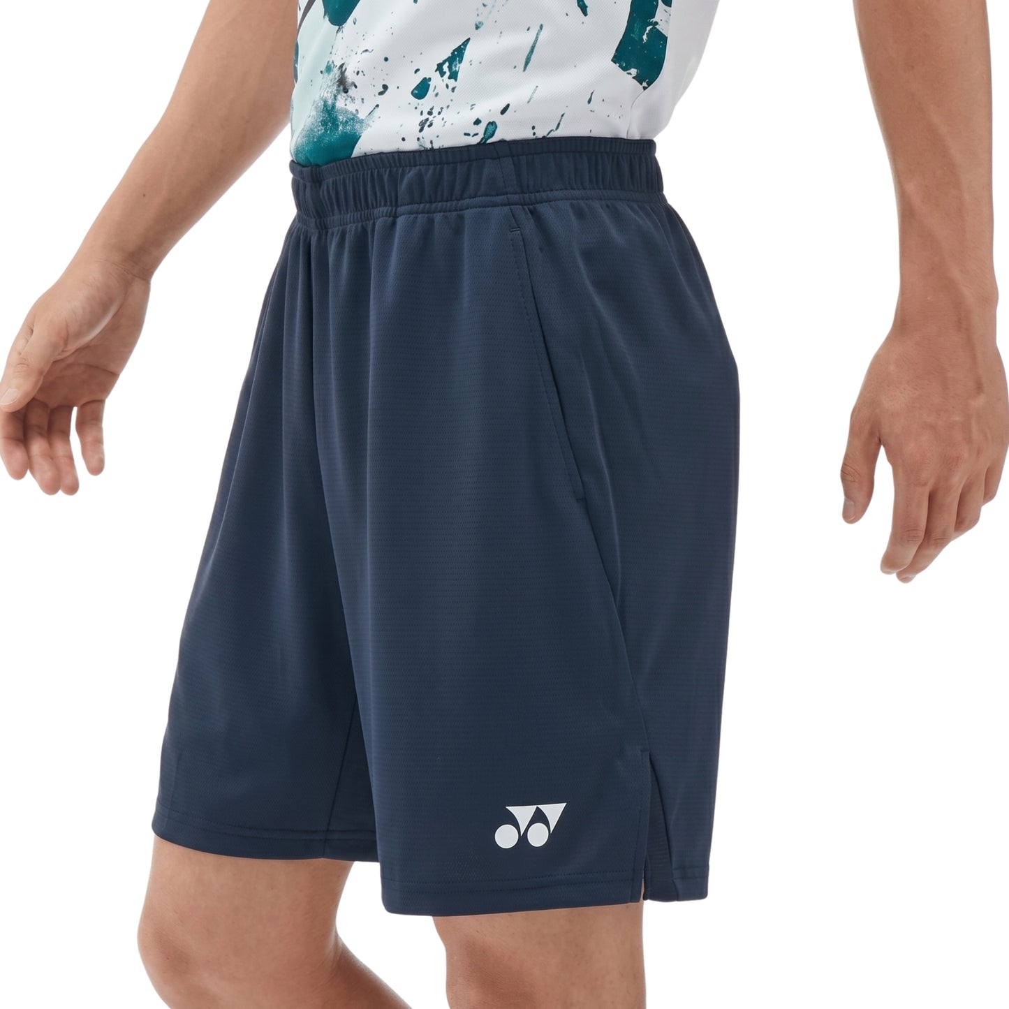 Navy Yonex shorts with a brand logo on a white background
