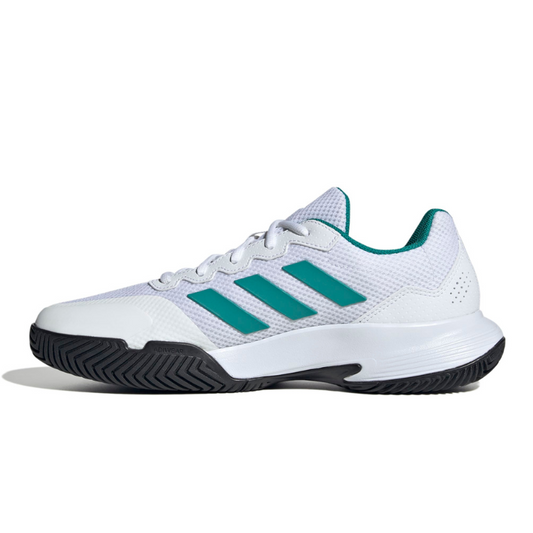 White adidas tennis shoe with green accents on a white background