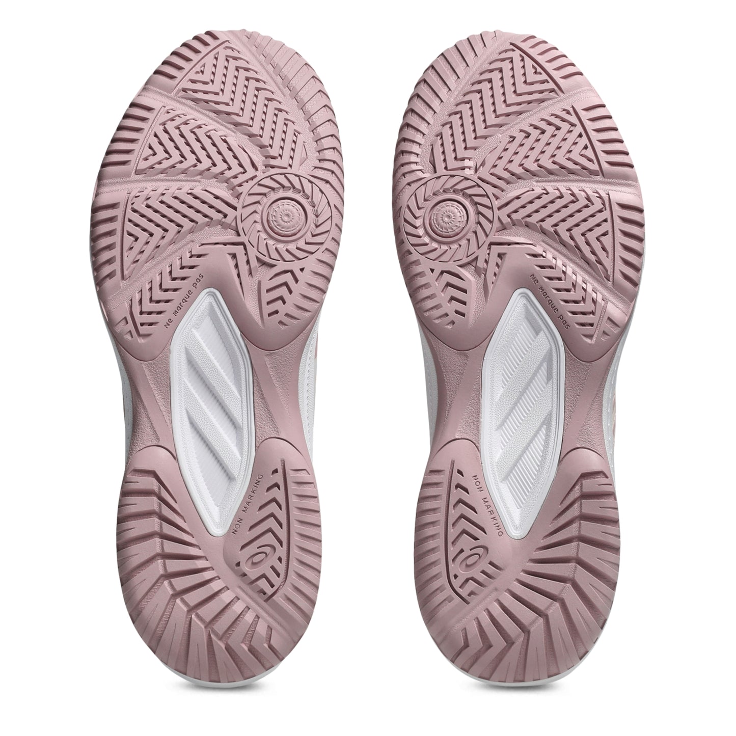Close-up of pink shoe soles with tread pattern on a white background