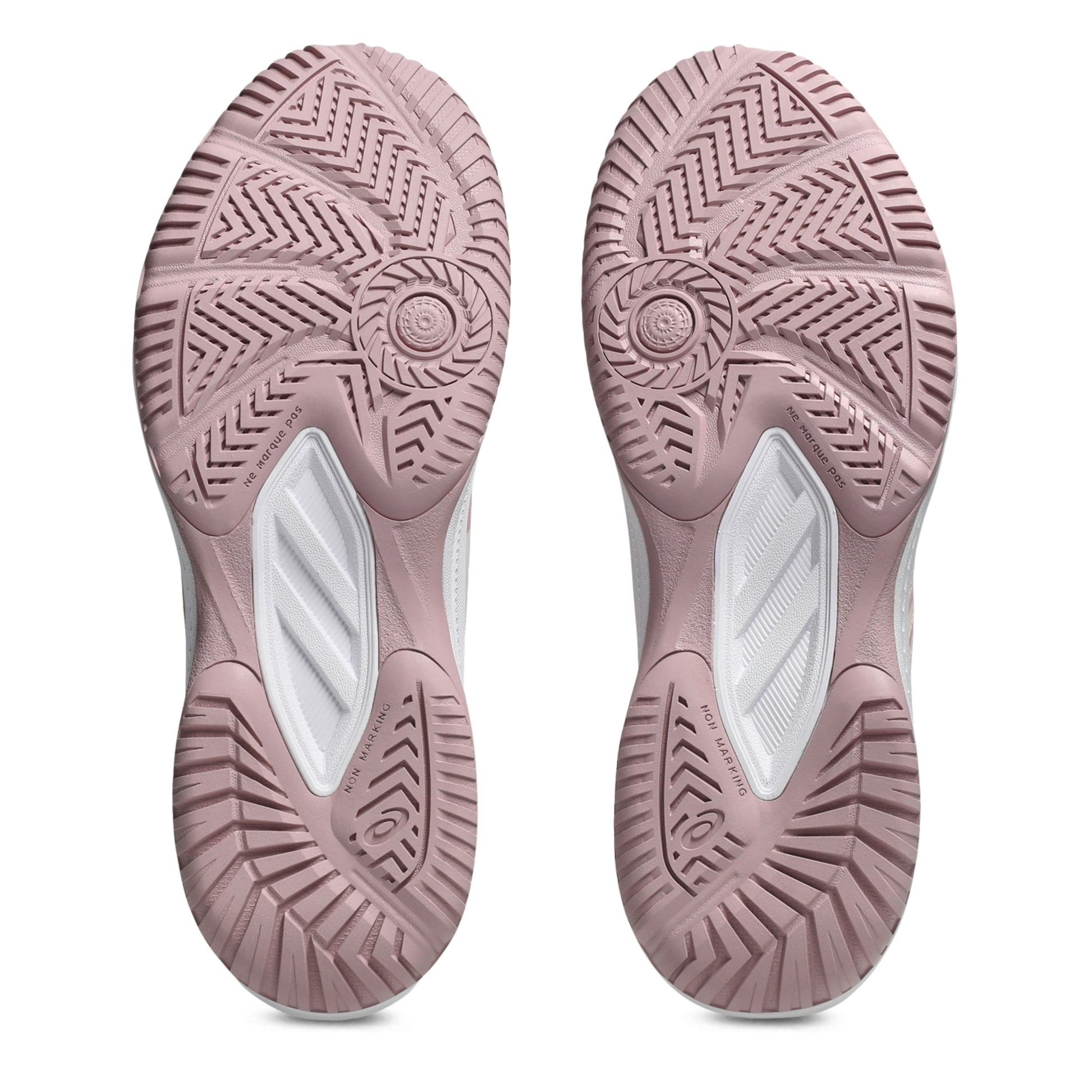 Close-up of pink shoe soles with tread pattern on a white background