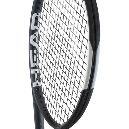 Close-up of a tennis racket with a white background