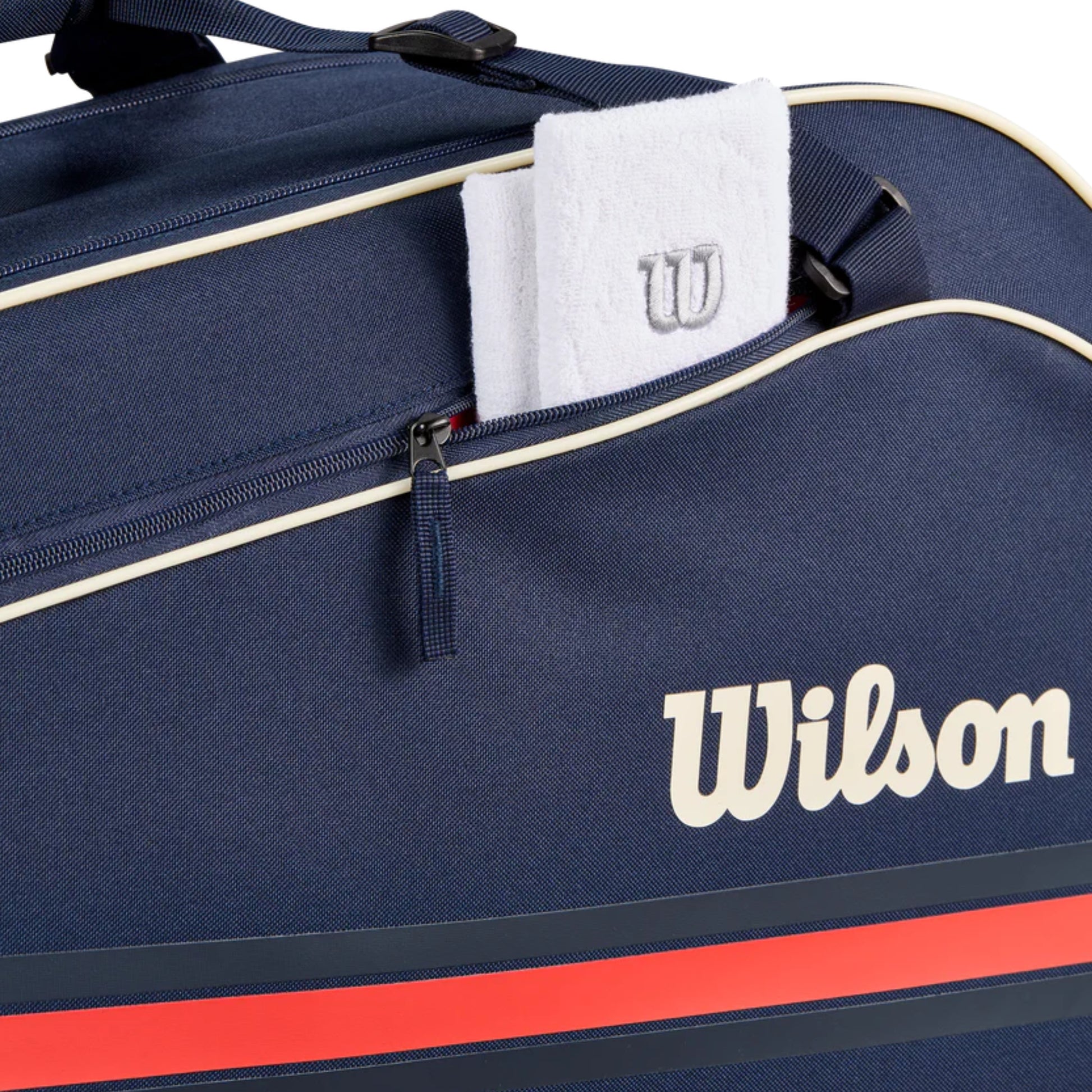 Navy blue Wilson sports bag with a white towel and logo