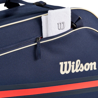 Navy blue Wilson sports bag with a white towel and logo