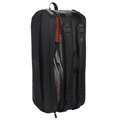 Black tennis bag with a clear compartment showing a shoe inside on a white background