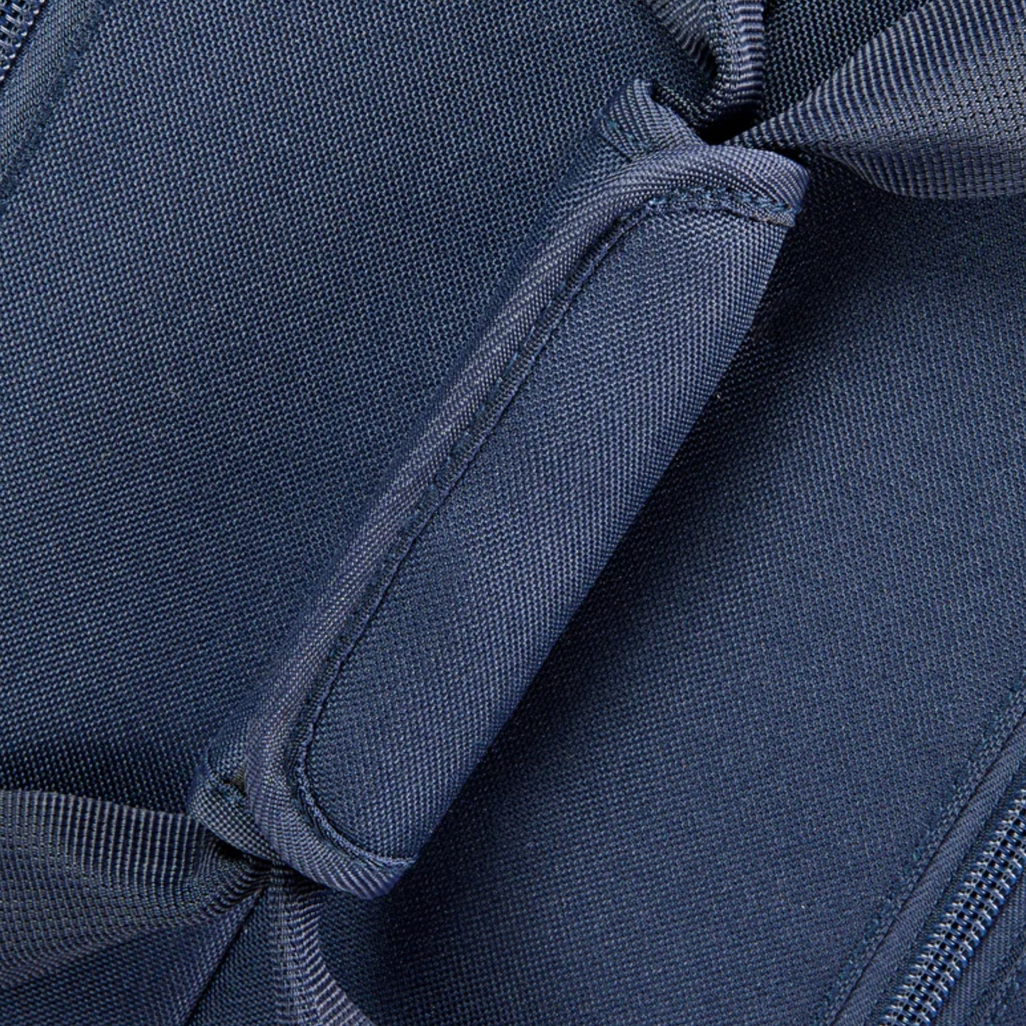 Close-up of a blue tennis bag with visible stitching details