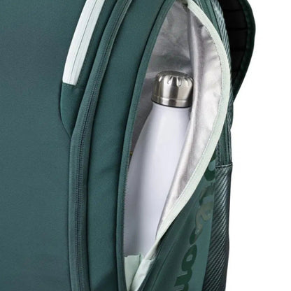 Green backpack with a white water bottle inside