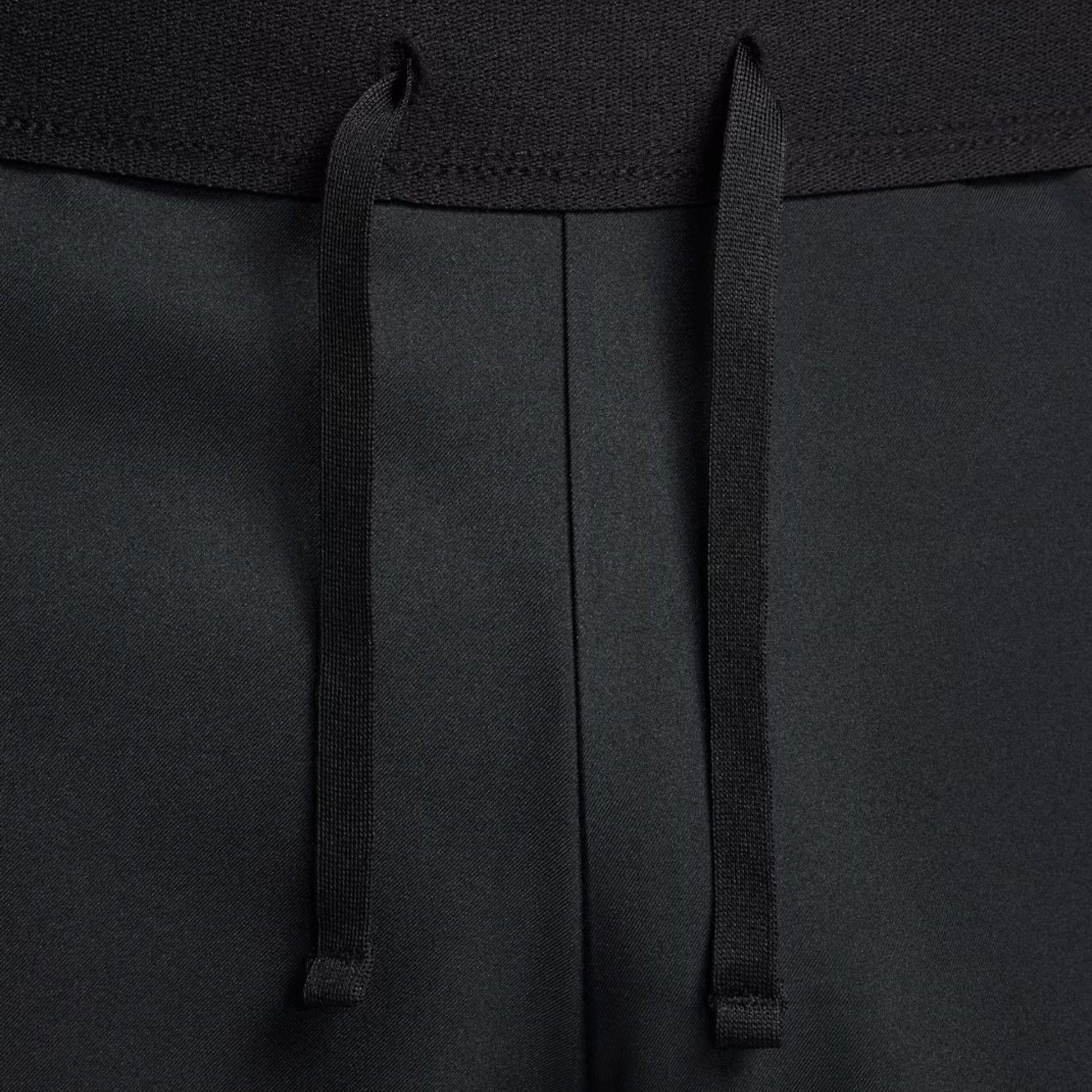 Close-up of black drawstrings on a black short