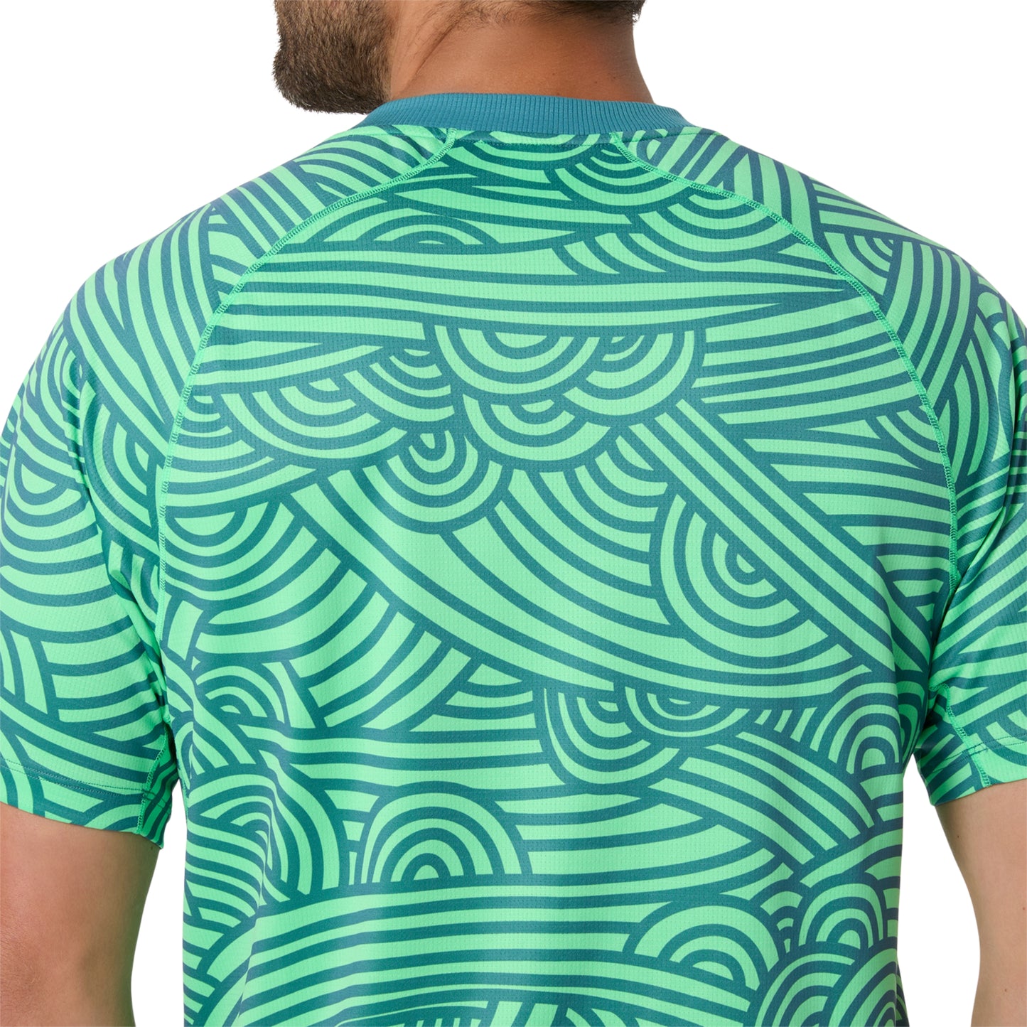 Green patterned shirt worn by a person on a white background
