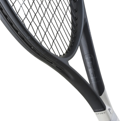 Close-up of a tennis racket with a white handle on a white background