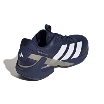 Navy blue Adidas shoe with white stripes on a white background