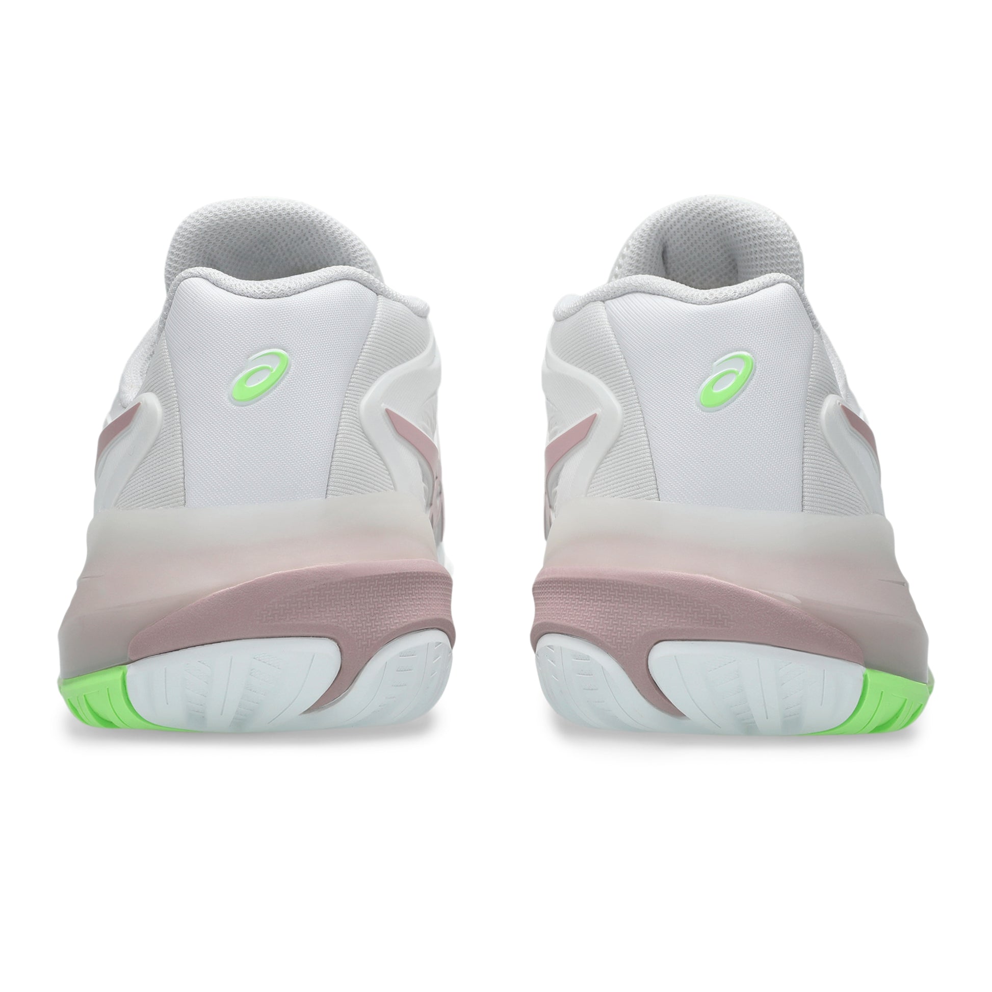 White tennis shoes with green accents on a white background