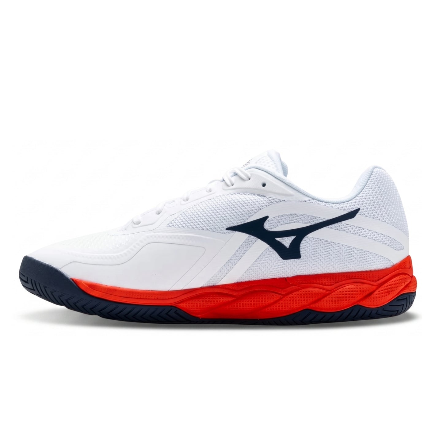 A white Mizuno tennis shoe with a navy blue logo and a vibrant red midsole accent, shown in a side profile on a white background.