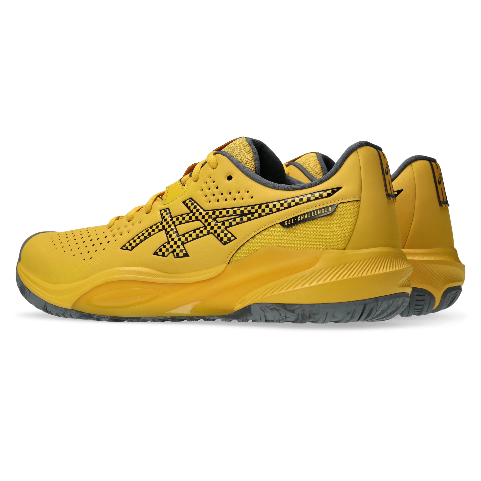 A pair of yellow Asics tennis shoes with black and yellow checkered details on the logo and side, shown against a plain white background.