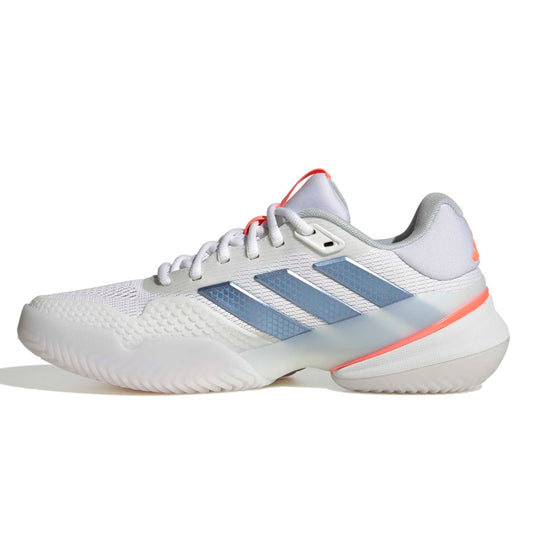 White Adidas tennis shoes with blue and orange accents on a white background
