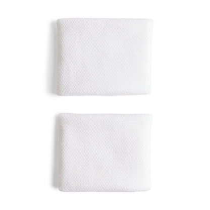 White adidas wristbands with a silver logo on a white bacground
