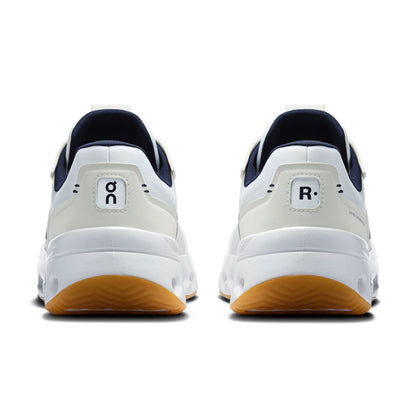 Back view of on blue and white tennis shoes on a white background