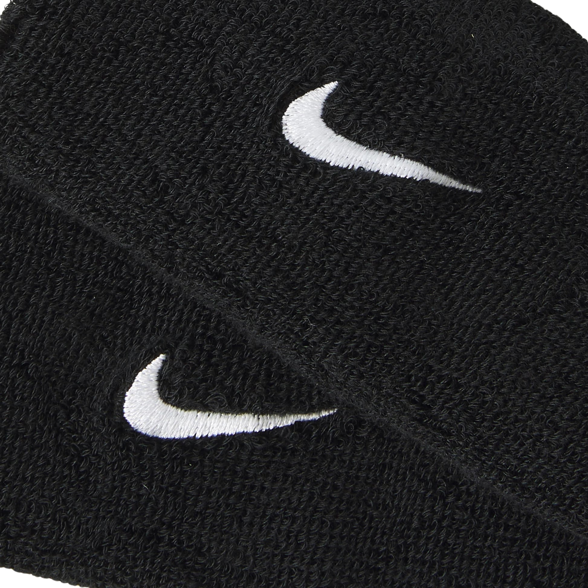 Two black wristbands with white Nike logos on a white background