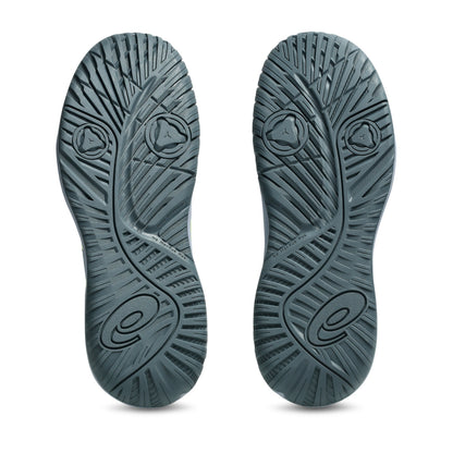 Two gray shoe soles with a textured pattern on a white background