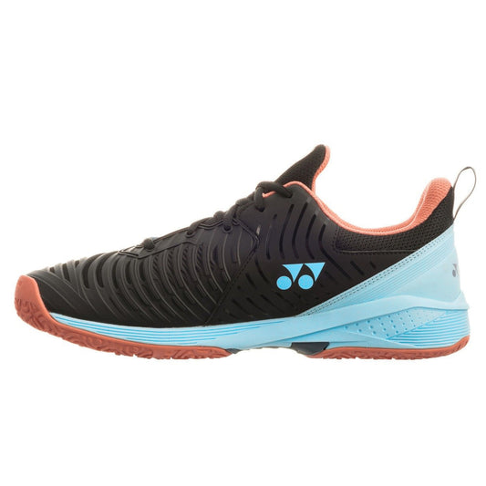 Black and blue Yonex tennis shoe with pink accents on a white background
