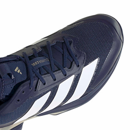 Navy blue adidas tennis shoe with white stripes on a white background