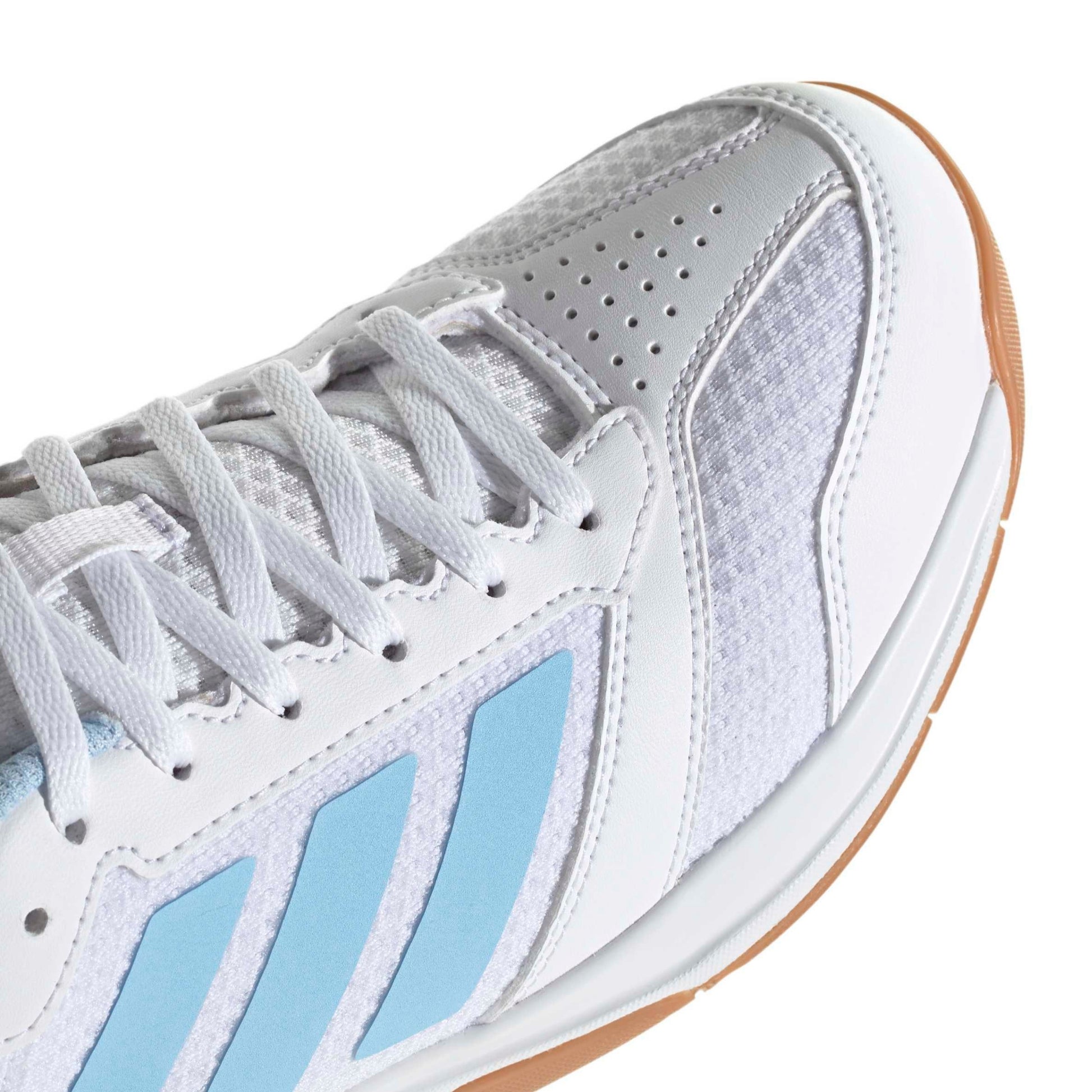 Close-up of a adidas shoe with blue accents on a white background