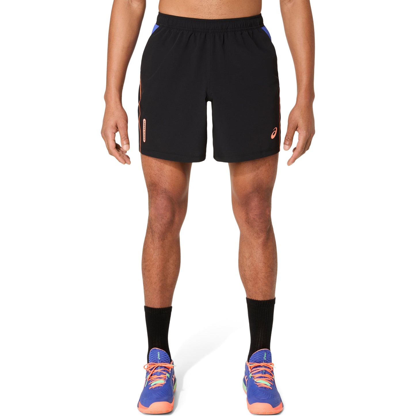 Person wearing black athletic shorts on a white background