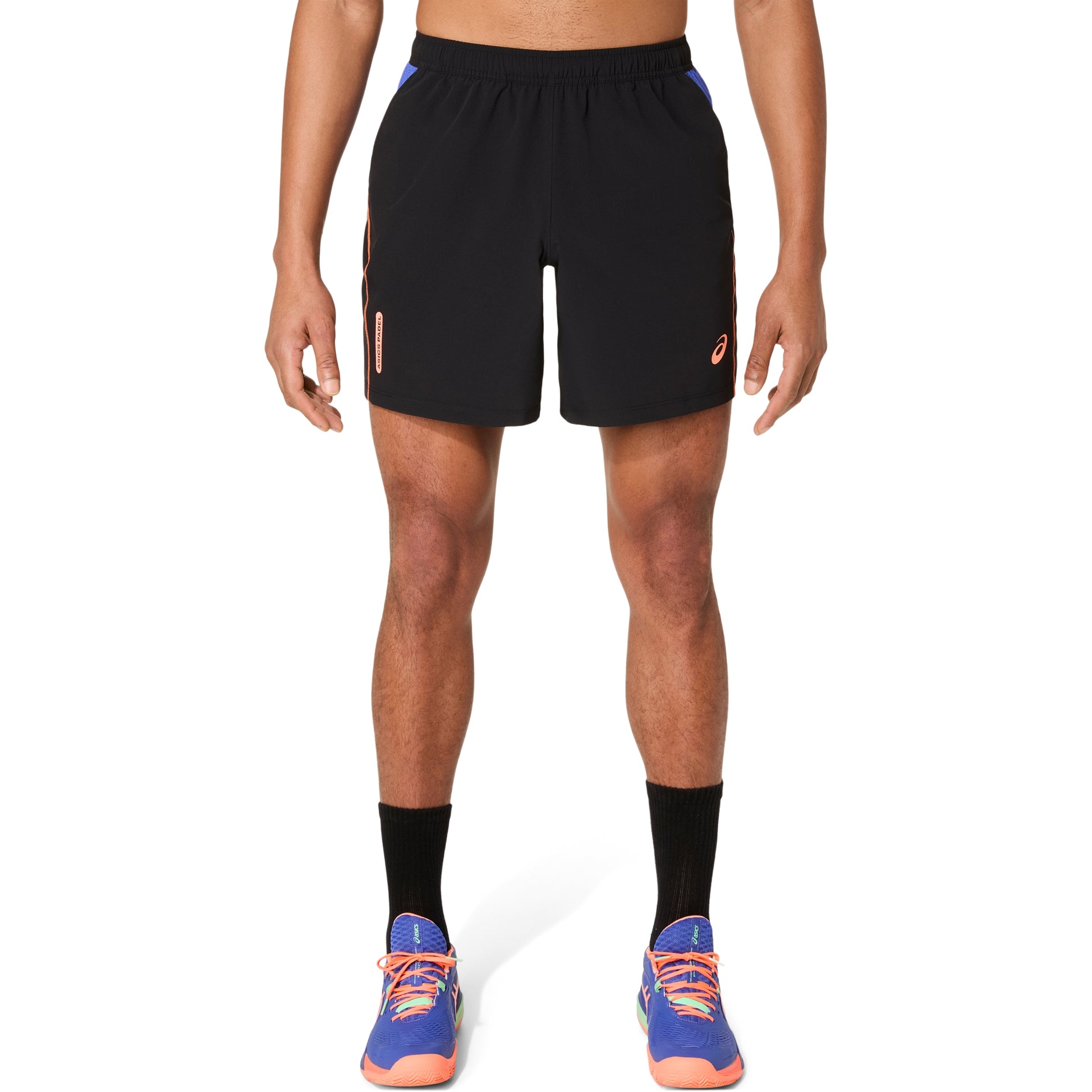 Person wearing black athletic shorts on a white background