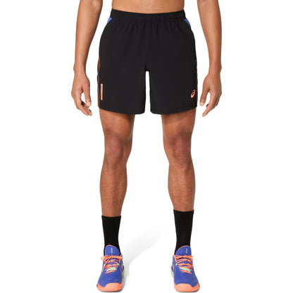 Person wearing black athletic shorts on a white background