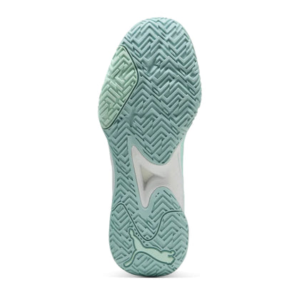 Close-up of a green netball shoe sole on a white background