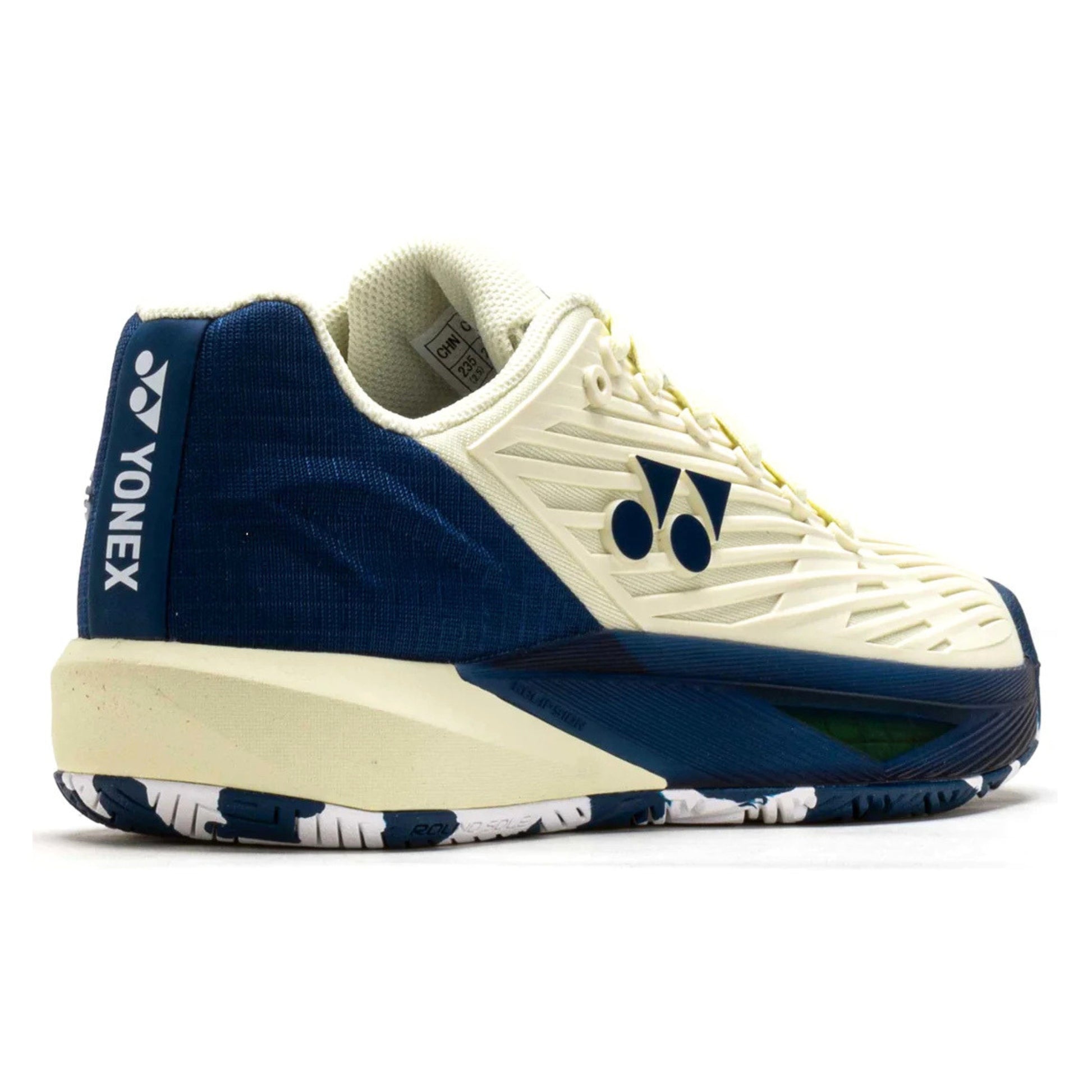 White and blue Yonex tennis shoe with brand logo on a white background