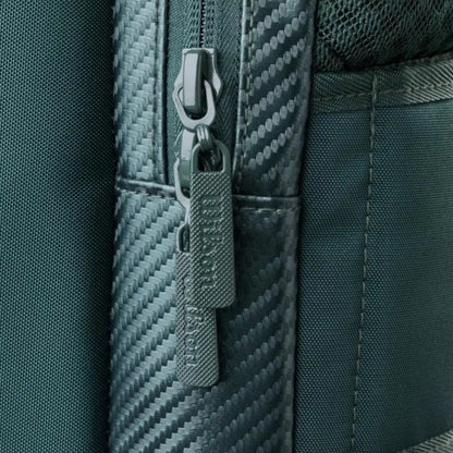 Close-up of a zipper on a textured green bag
