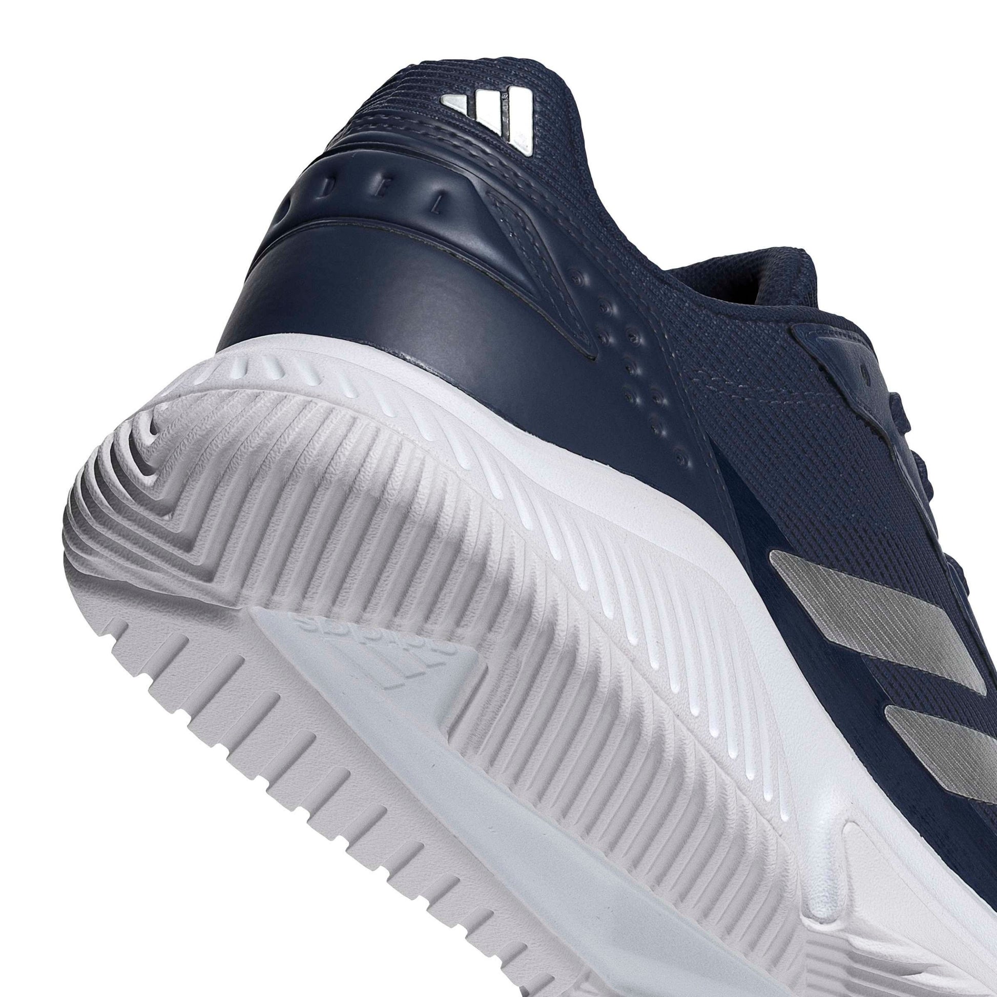 Close-up of a shoe blue padel shoe with a white tread pattern on a white background