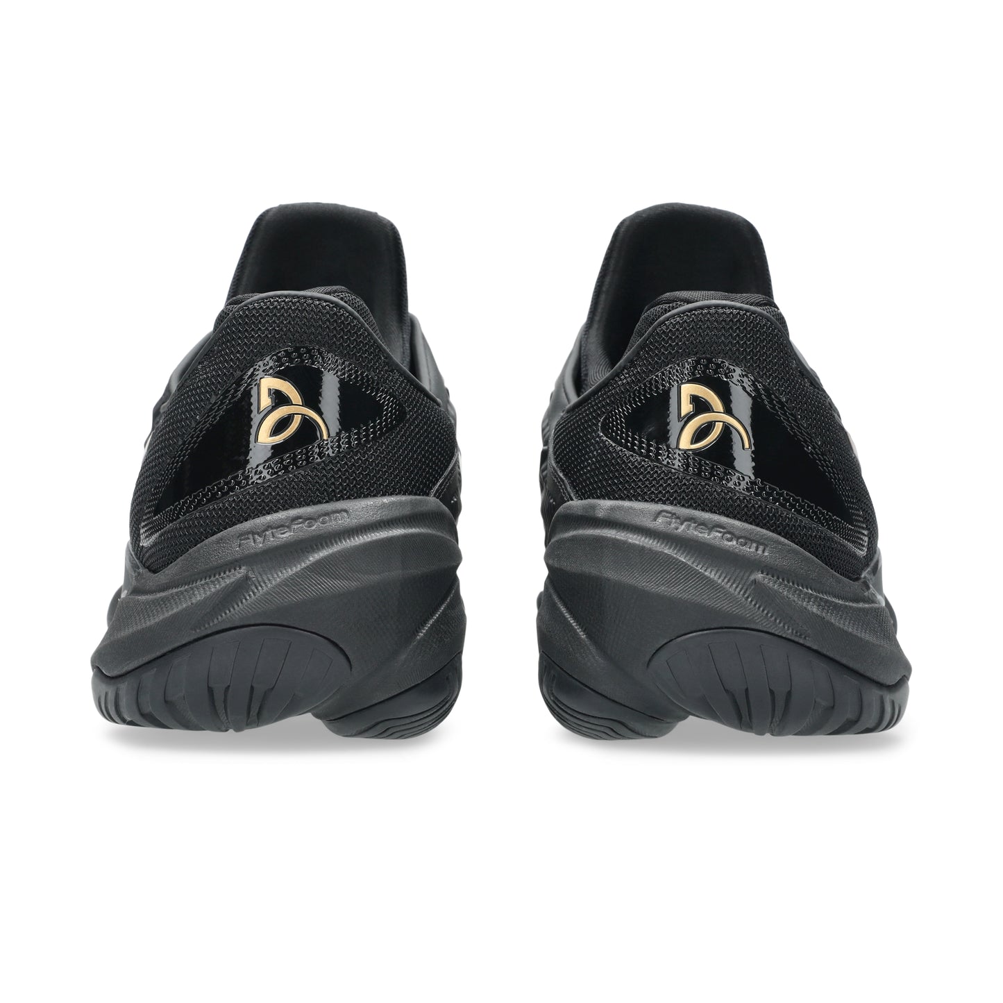 Black tennis shoes with a brand logo on a white background