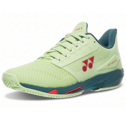 Light green Yonex shoe with blue and red accents on a white background