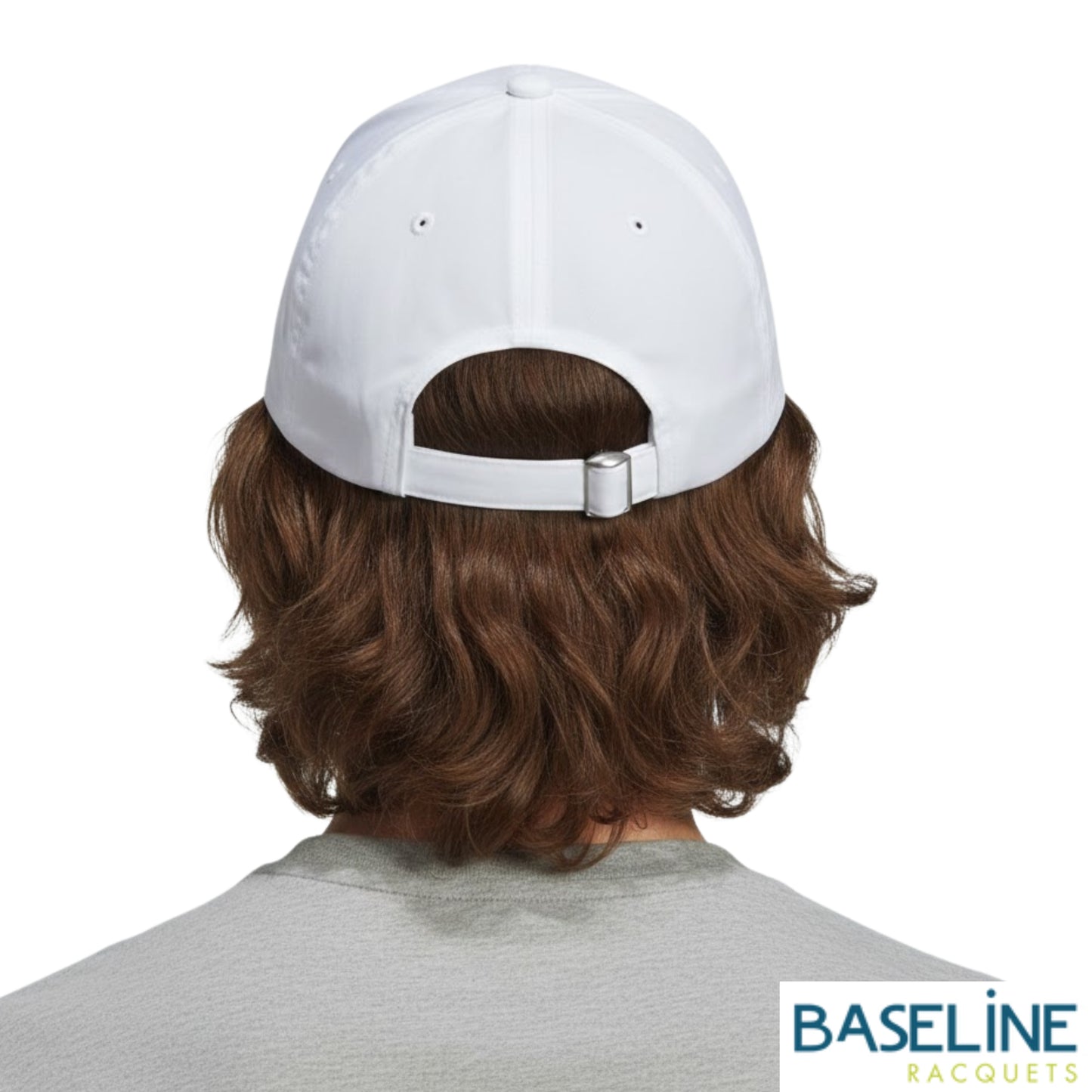 Person wearing white Adidas cap on a white background