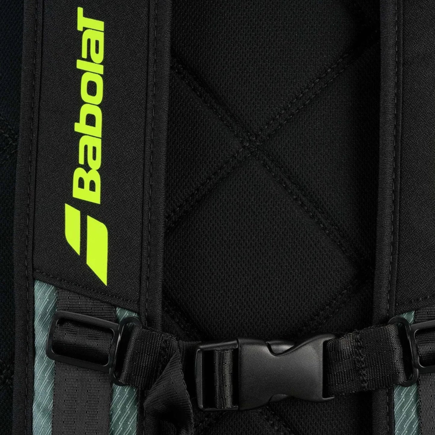 Close-up of a black backpack with Babolat logo and straps.
