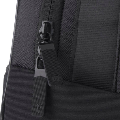 Close-up of a black tennis bag zipper with brand logo on a white background
