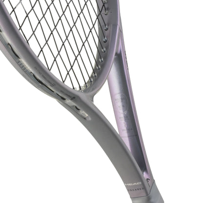 Close-up of a tennis racket with a white background